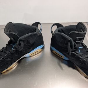 Jordan Black and Gold Athletic Shoes
